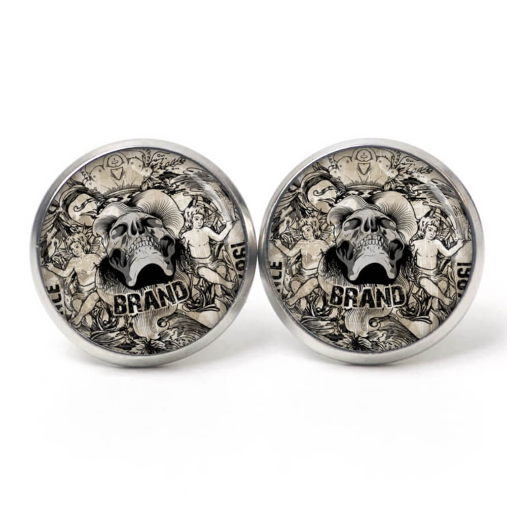 Ohrstecker, Ohrhänger, Clipse & Druckknopf – Motiv Totenkopf mit 2 Jungen – Schmuck aus Edelstahl Ohrstecker, Ohrhänger, Clipse & Druckknopf – Motiv Totenkopf mit 2 Jungen – Schmuck aus Edelstahl