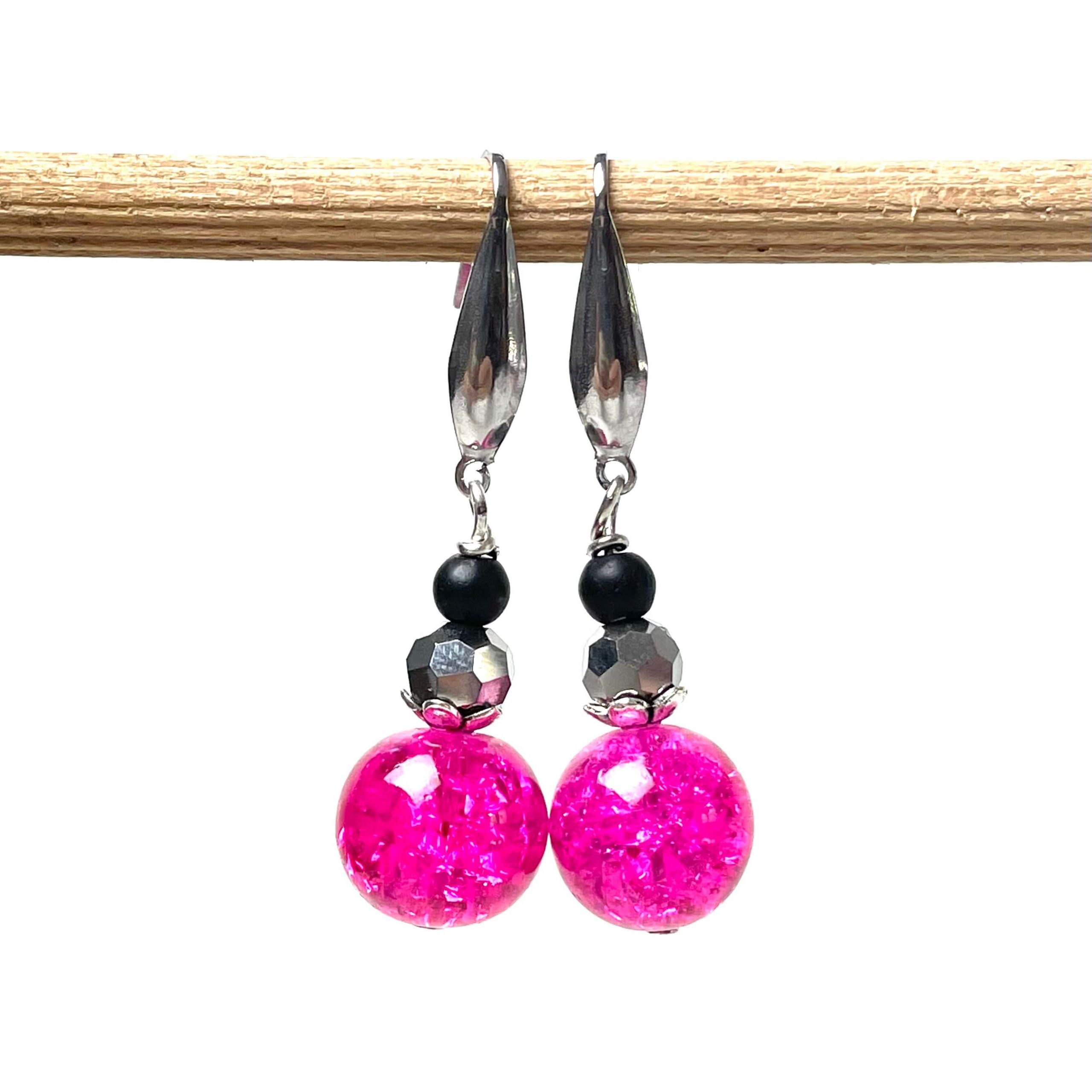 Edelstahl Ohrringe im 80er Jahre Disco Stil in pink und schwarz Edelstahl Ohrringe im 80er Jahre Disco Stil in pink und schwarz