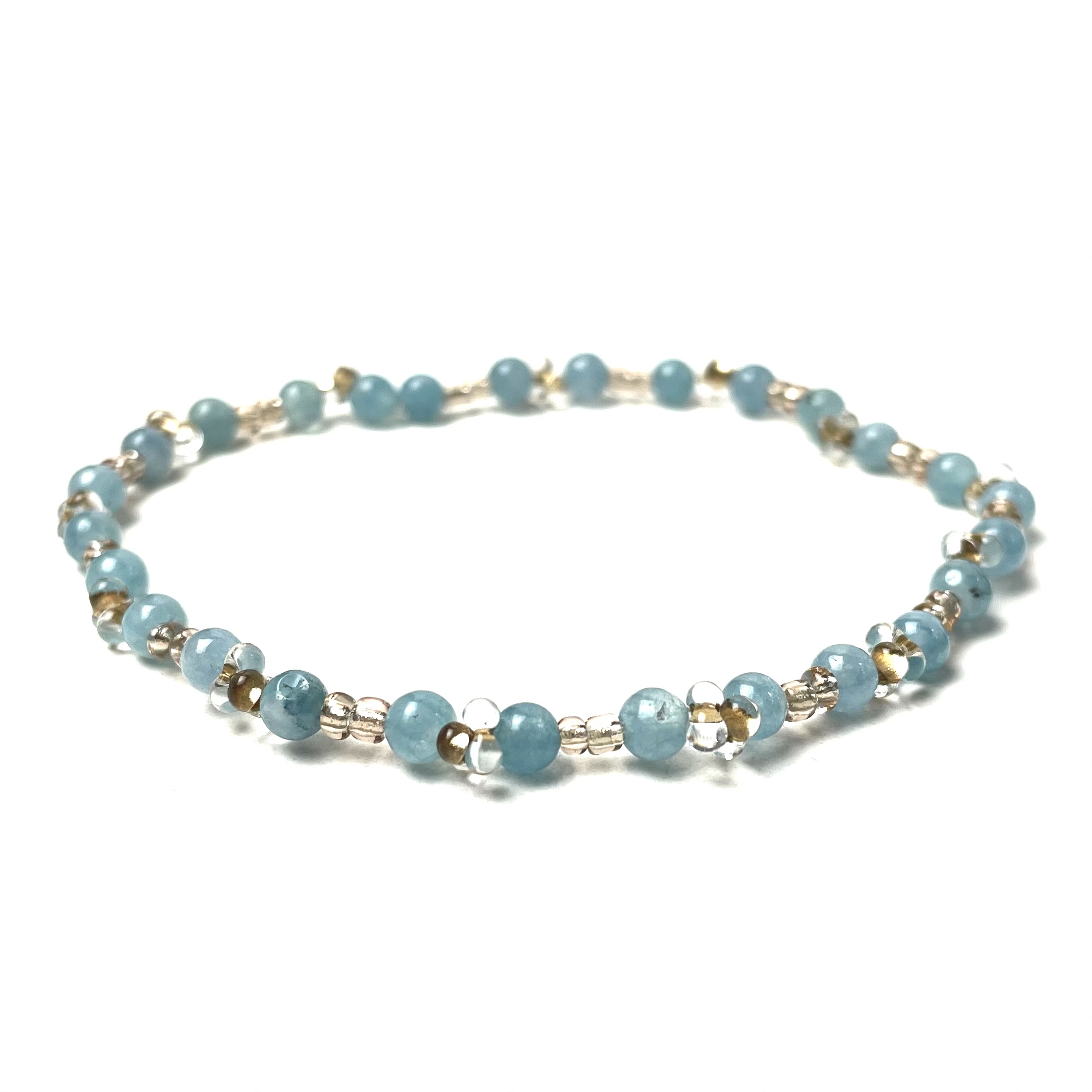 Zartes Perlenarmband mit blauer Jade und goldenen Glasperlen – stabiles Gummiband Zartes Perlenarmband mit türkiser Jade und goldenen Glasperlen - Gummiband