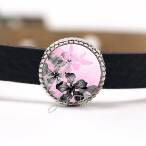Schiebeperle mit einem grau / rosa Blumenmotiv